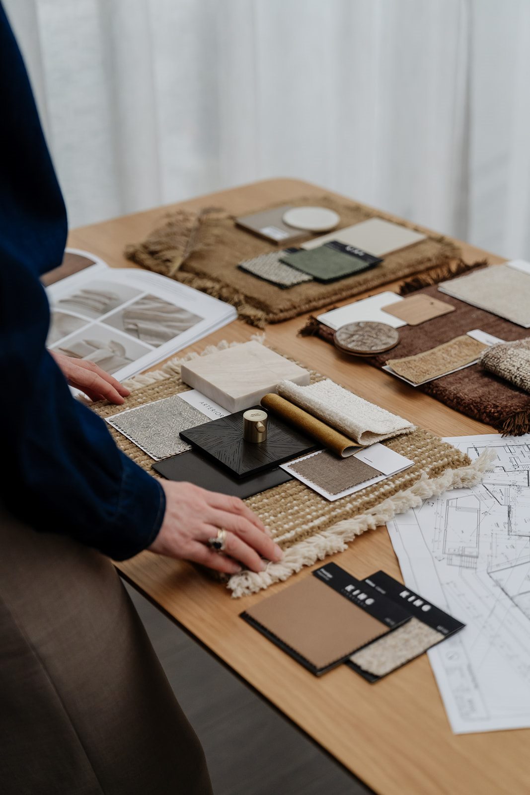 Jackie arranging fabric and material samples
