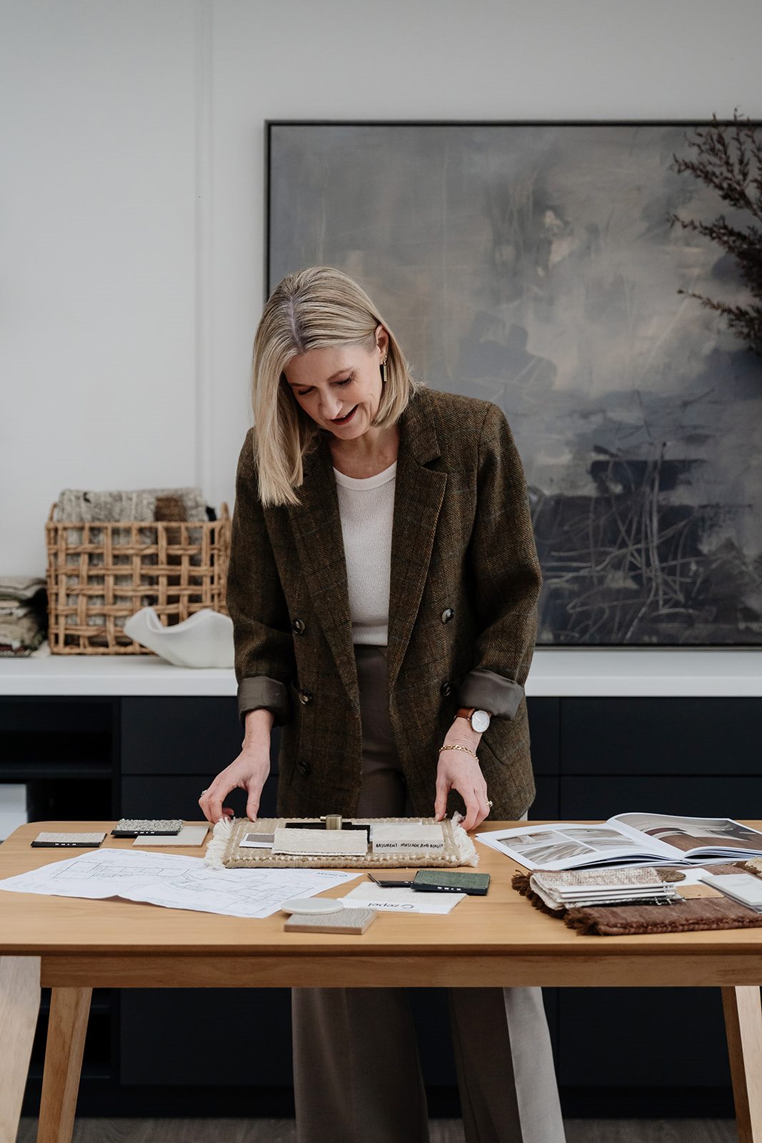 Jackie reviewing samples at a table