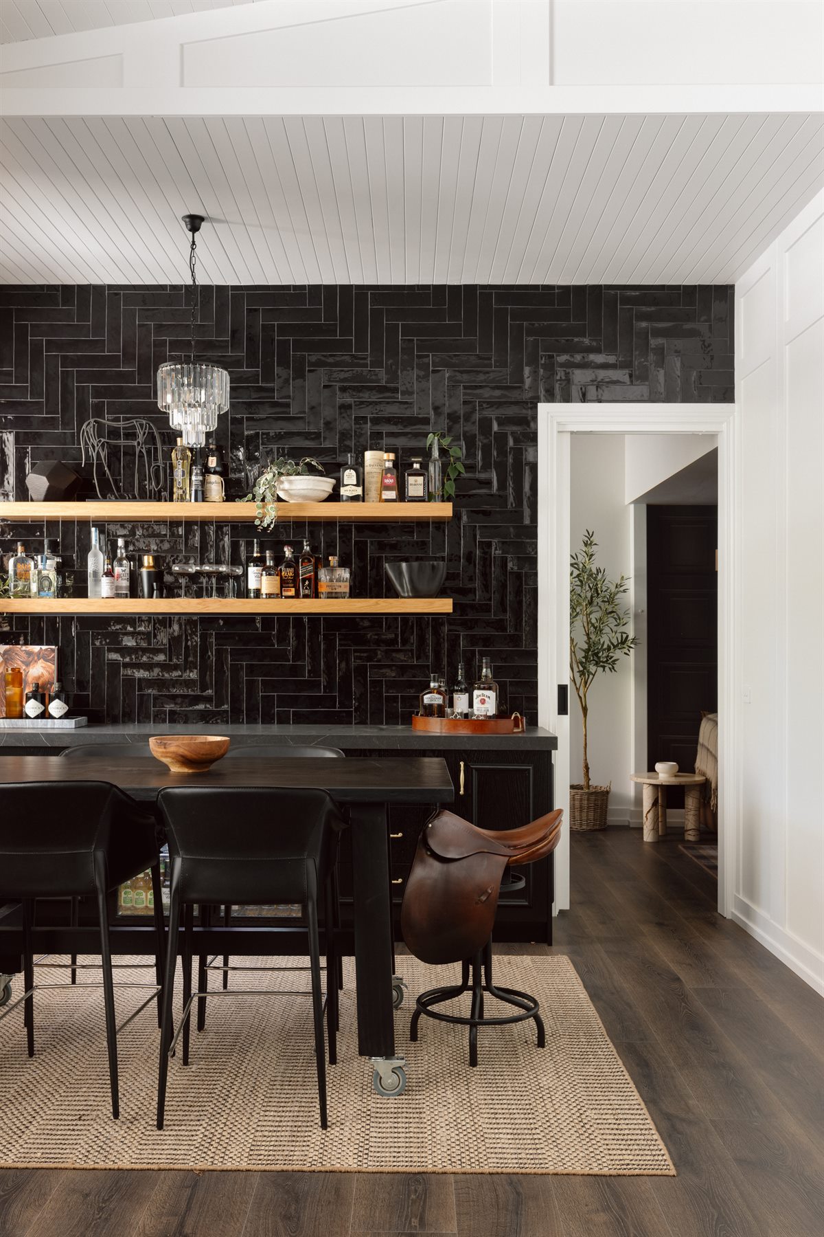 The Stables dining area with black brick wall